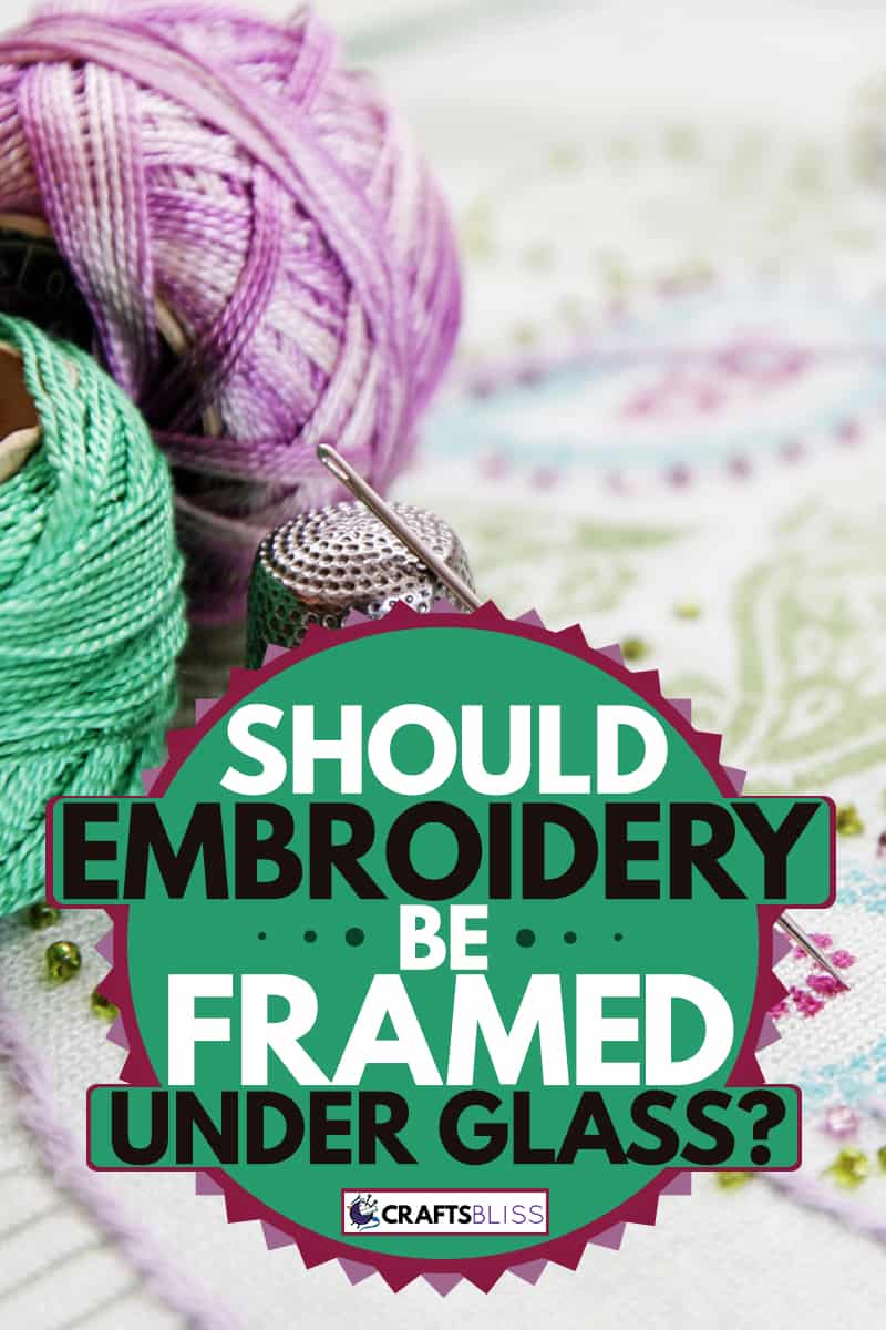 An embroidery piece with a light green and purple colored thread, Should Embroidery Be Framed Under Glass?