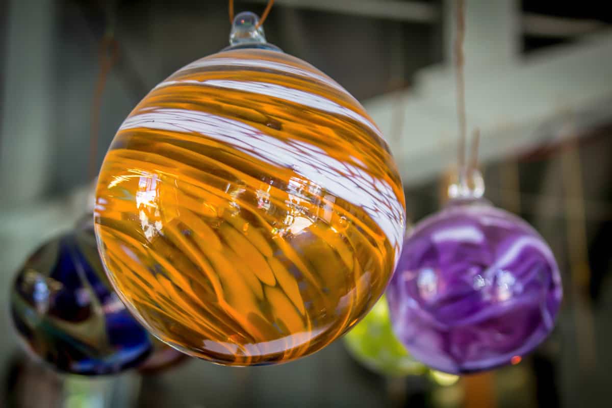 A newly painted glass bulb with different colors and hanged to cool