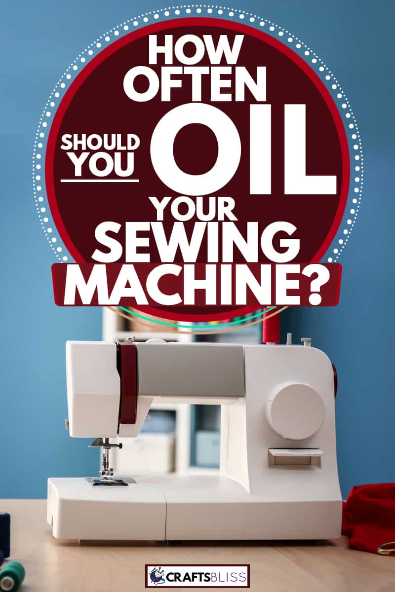 A sewing machine on a wooden table with needles and threads on the side, How Often Should You Oil Your Sewing Machine?