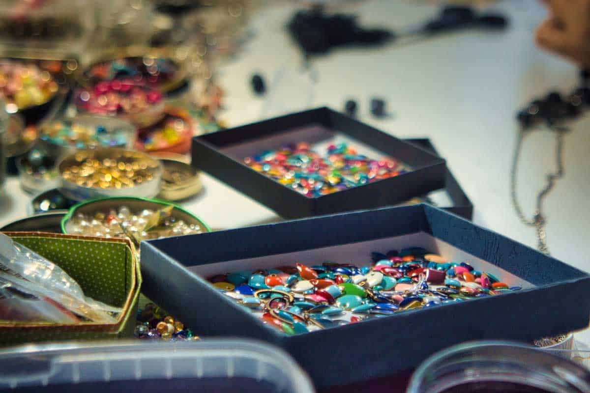 Multicolored beads inside boxes and containers