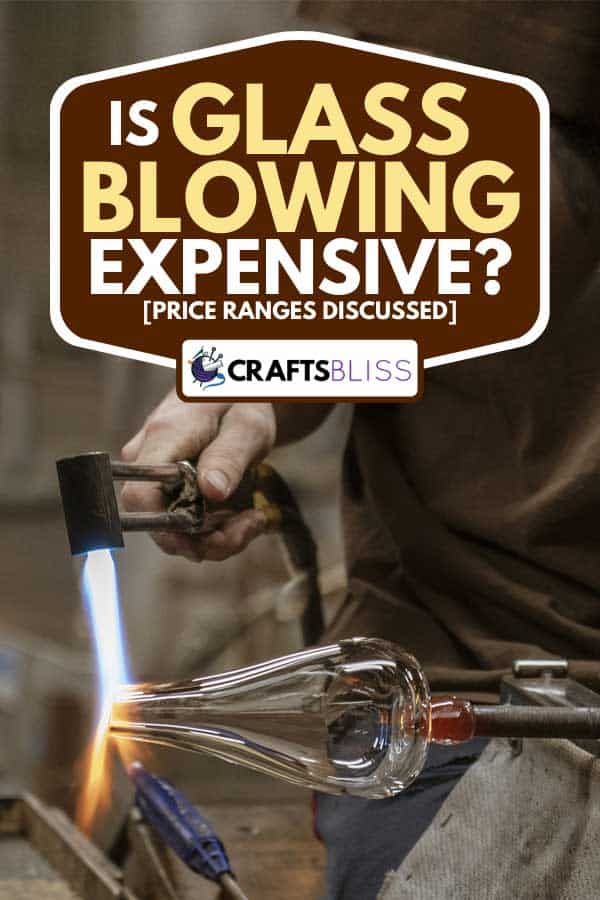 Glass blowing artist forms a blob of glass into a vessel using a gas torch, Is Glass Blowing Expensive? [Price ranges discussed]