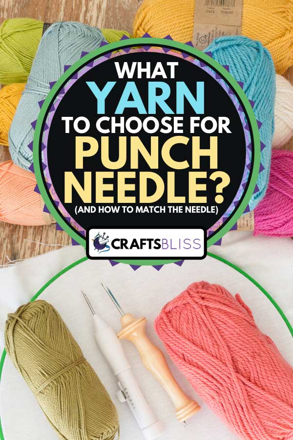 Colorful yarn with punch needles and white fabric on a wooden table, What Yarn To Choose For Punch Needle (And How To Match The Needle)?