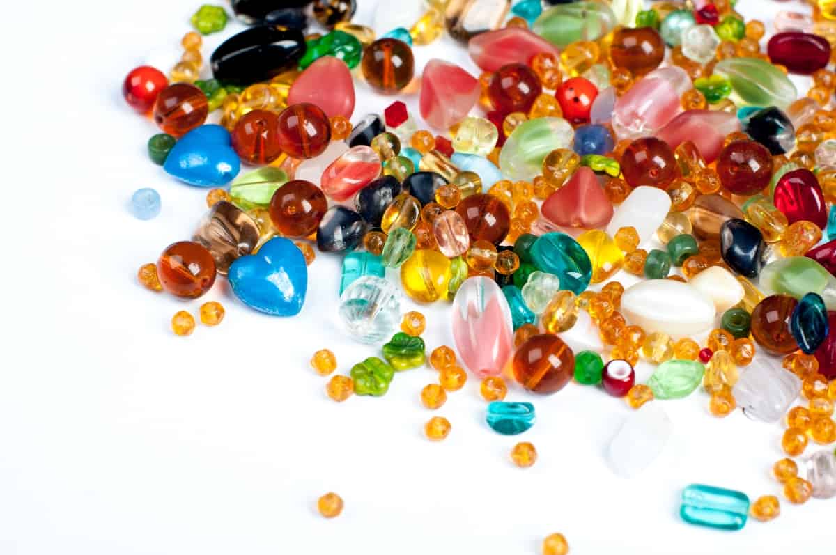 colorful glass beads on white background
