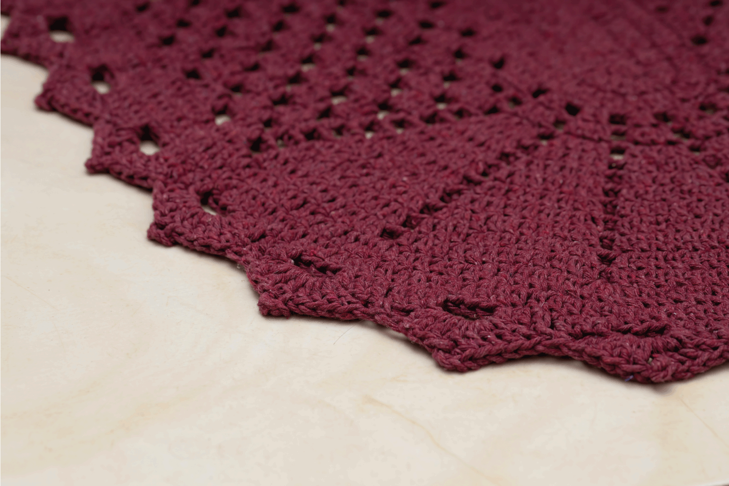 Red crochet rug handmade in close up