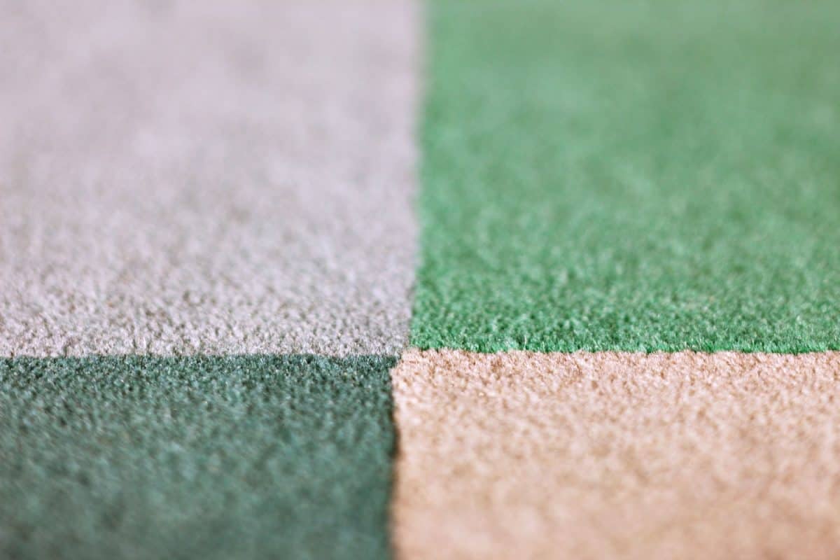 A detailed photo of a carpet in different colors