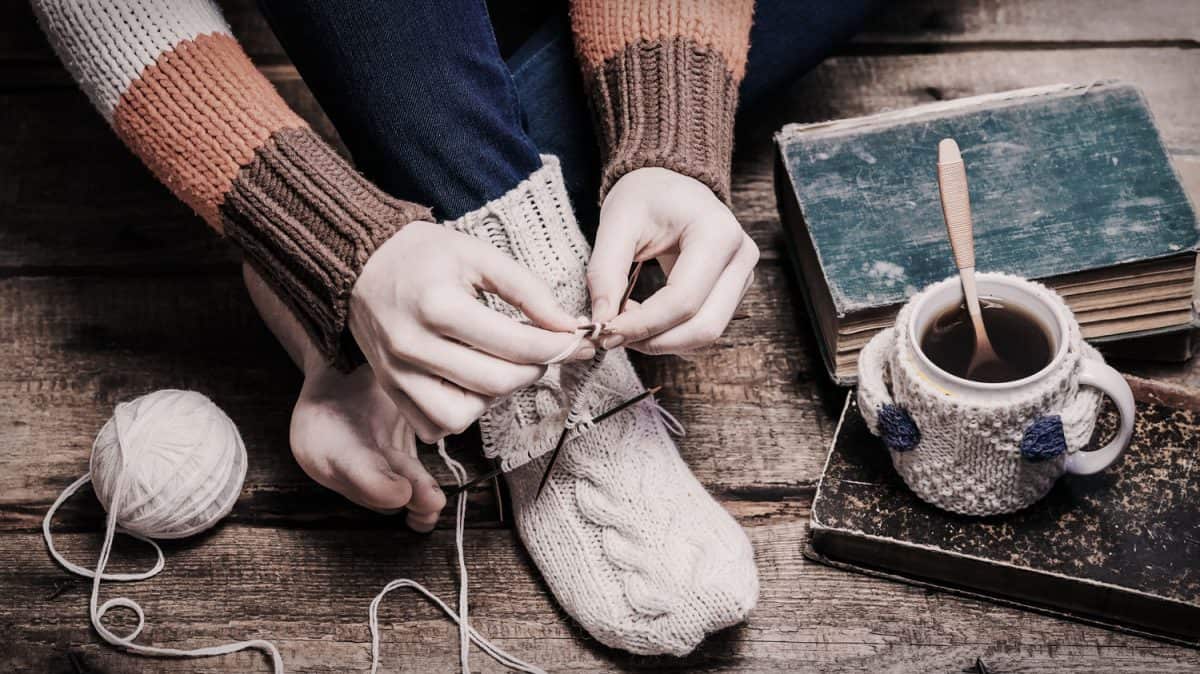A woman knitting her socks