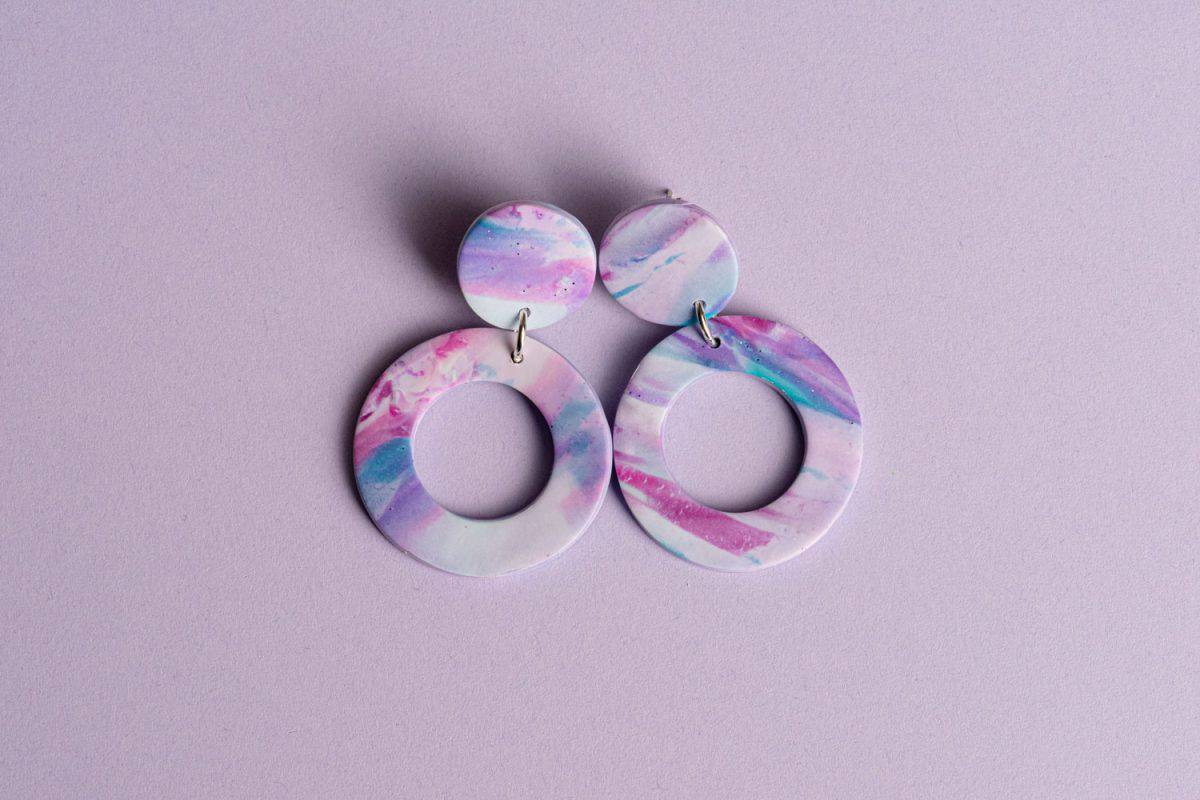 Beautiful polymer clay earring on a purple background