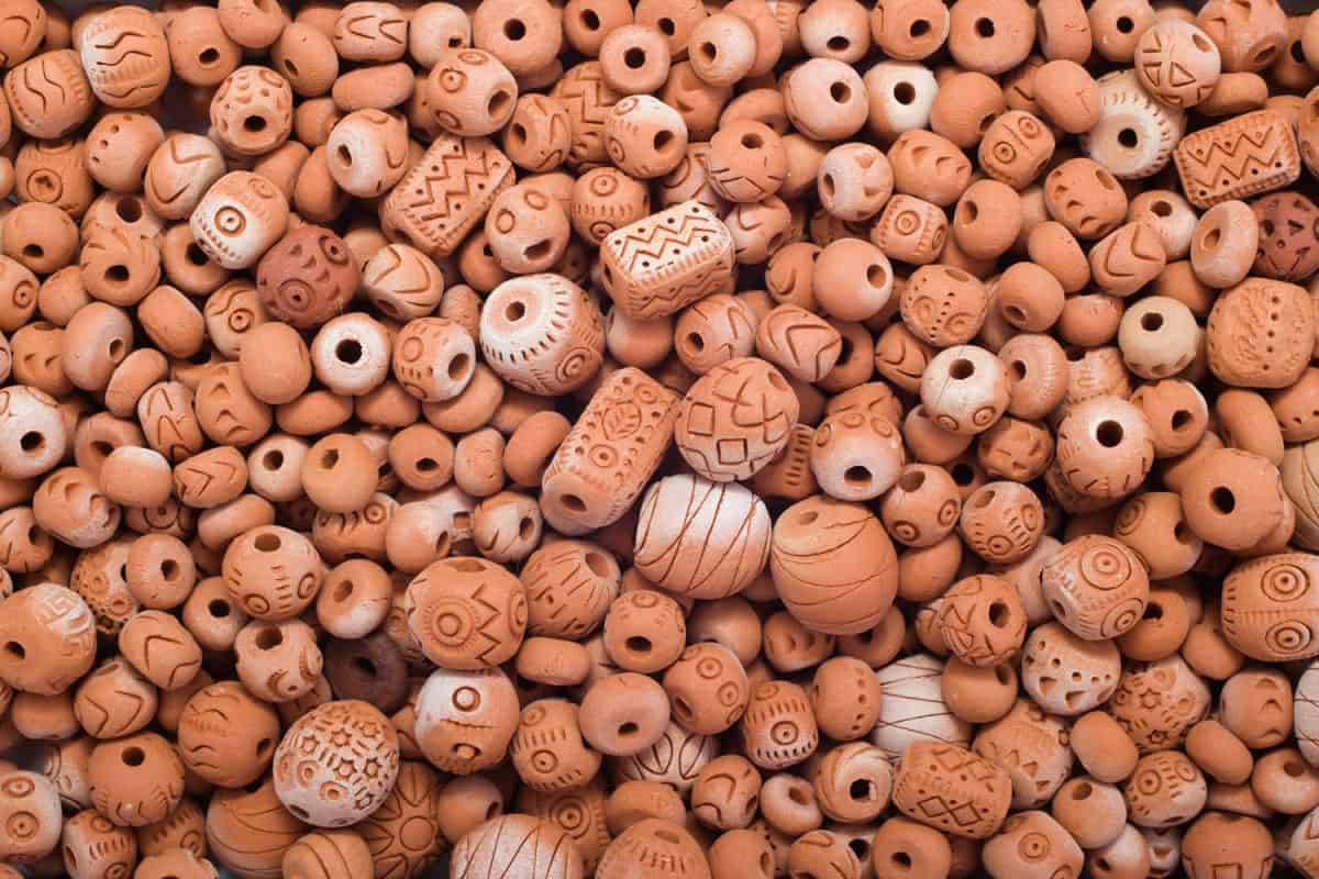 Clay beads with carved designs