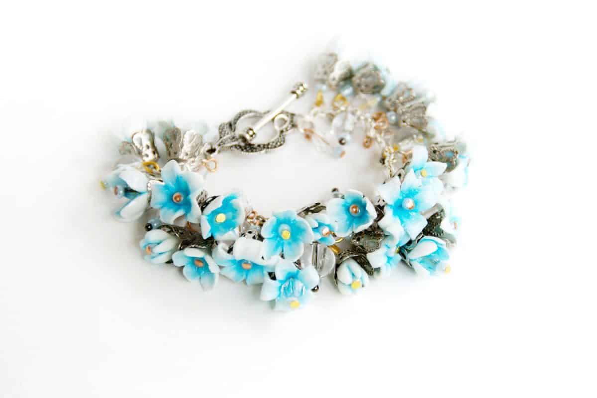 Polymer clay bracelet flowers on a white background