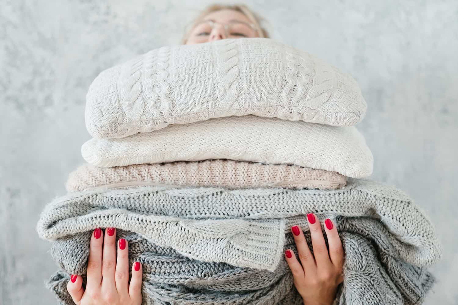 Woman knitted plaid blanket cozy winter home