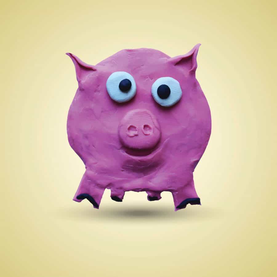 Pink pig in front view. Vector illustration. Plasticine modeling.