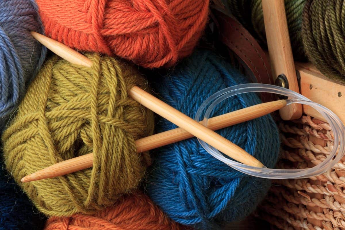 Up close photo of Marino wool yarn and a crochet hook