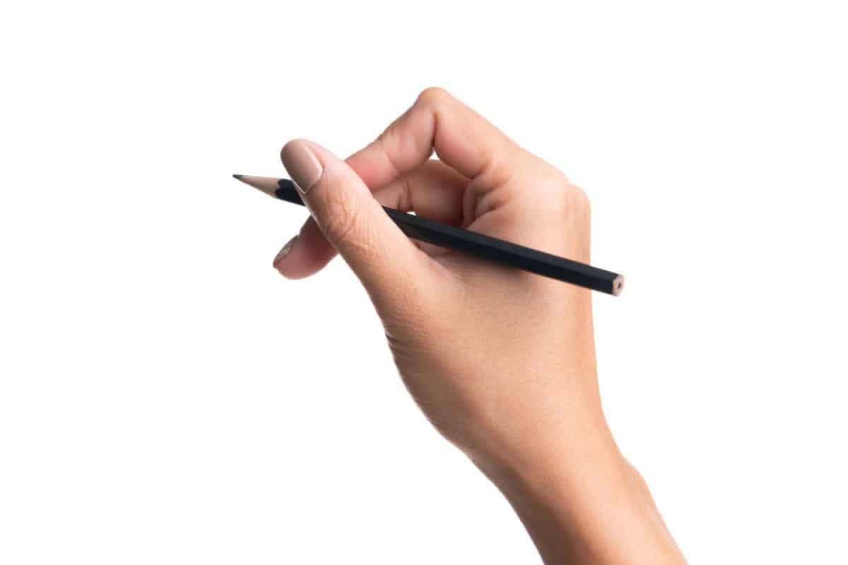 Woman holding a pencil on white background