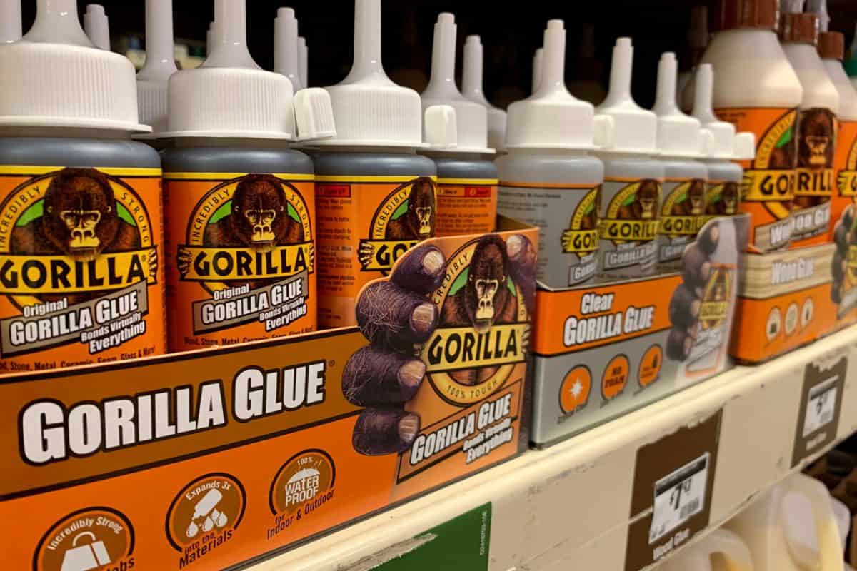 A shelf filled with Gorilla glue products