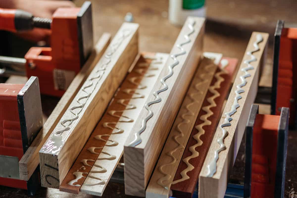 Wood glue spread on wooden planks