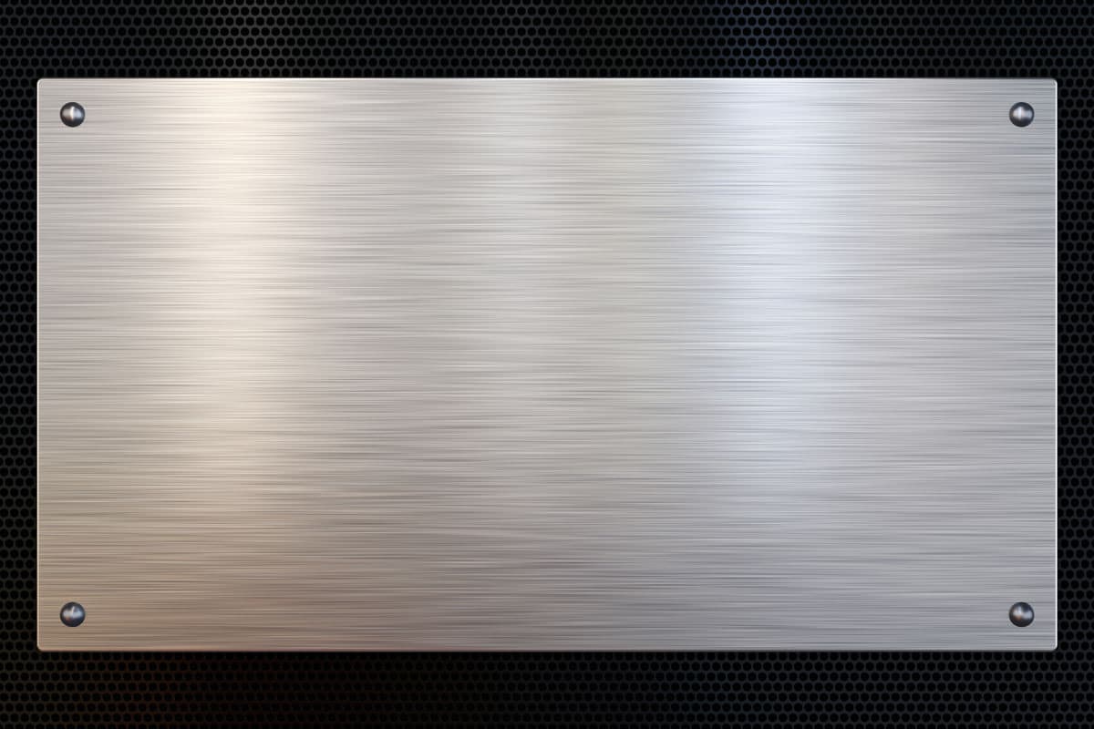 Brushed metal plate on perforated metal