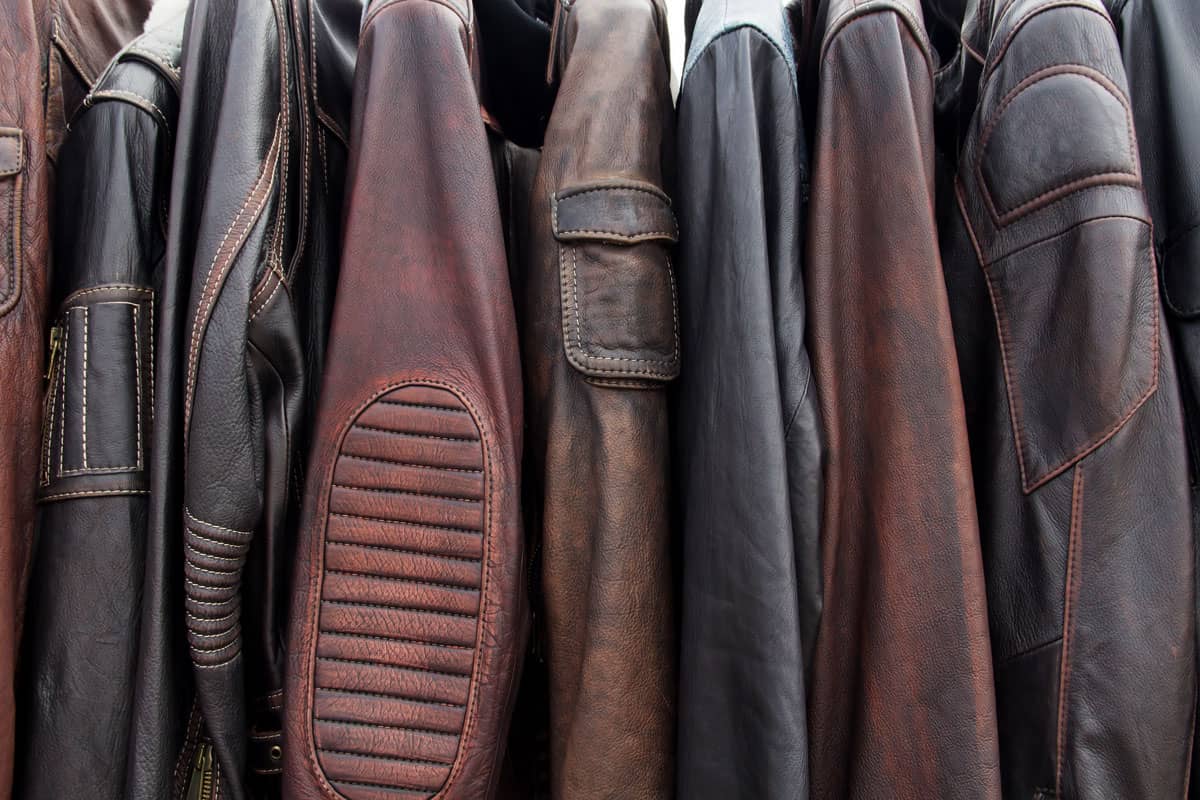 Collection of leather jackets on hangers in the shop.