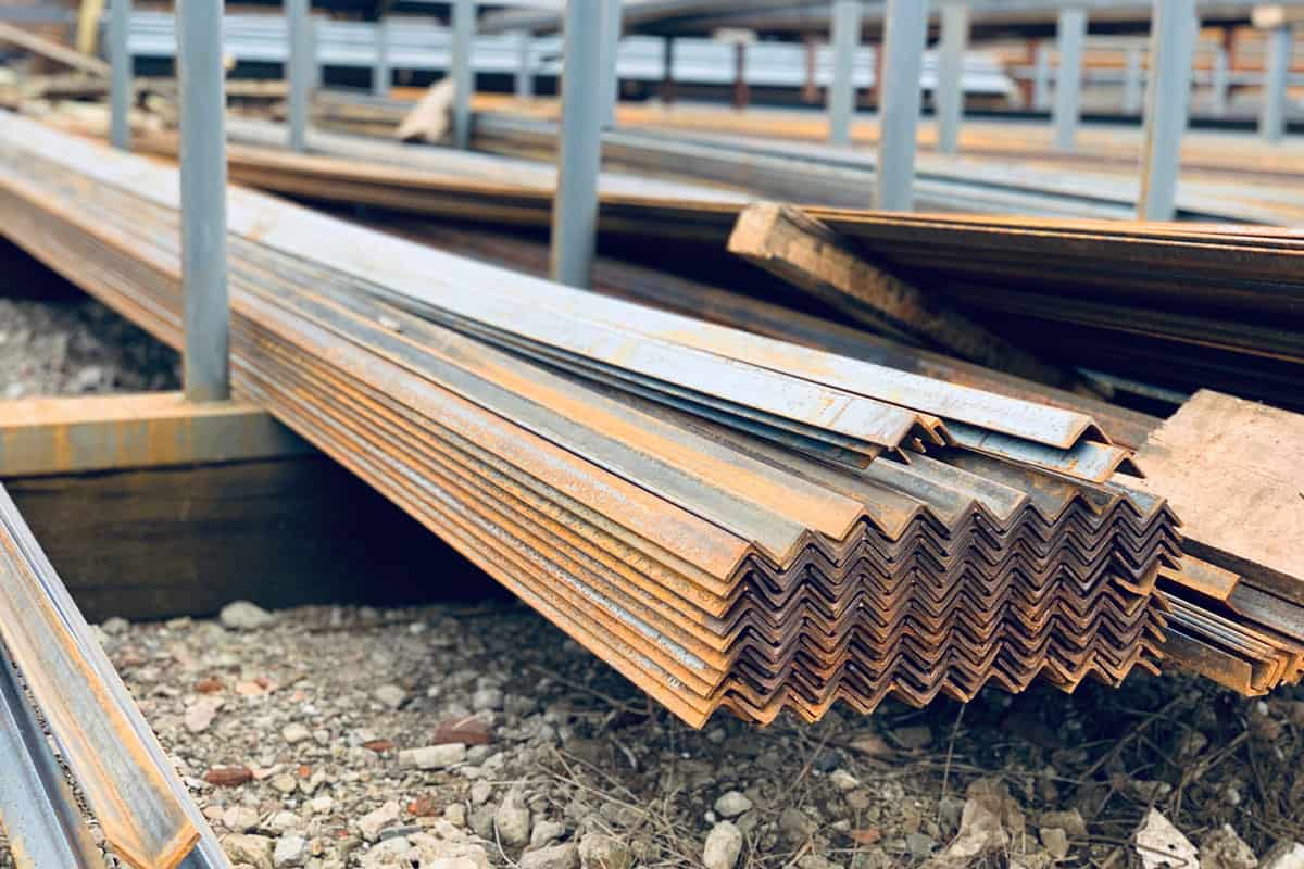 Steel jagged lines all in a row. Metal profile angle in packs at the warehouse of metal products