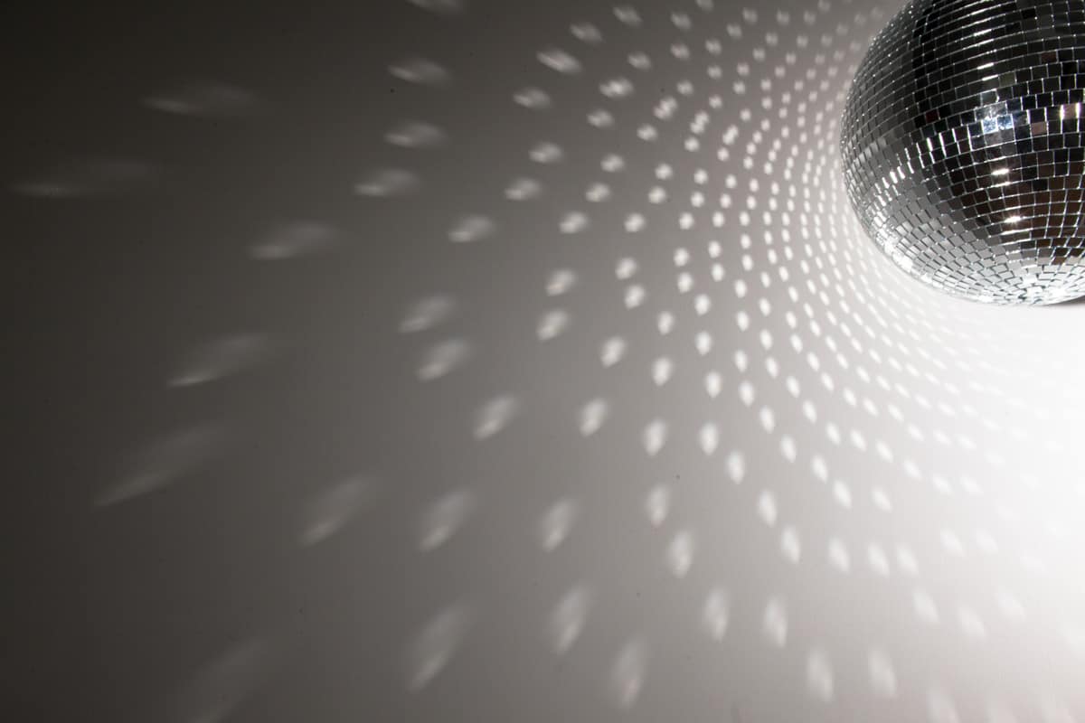 Up close photo of a Disco ball spinning